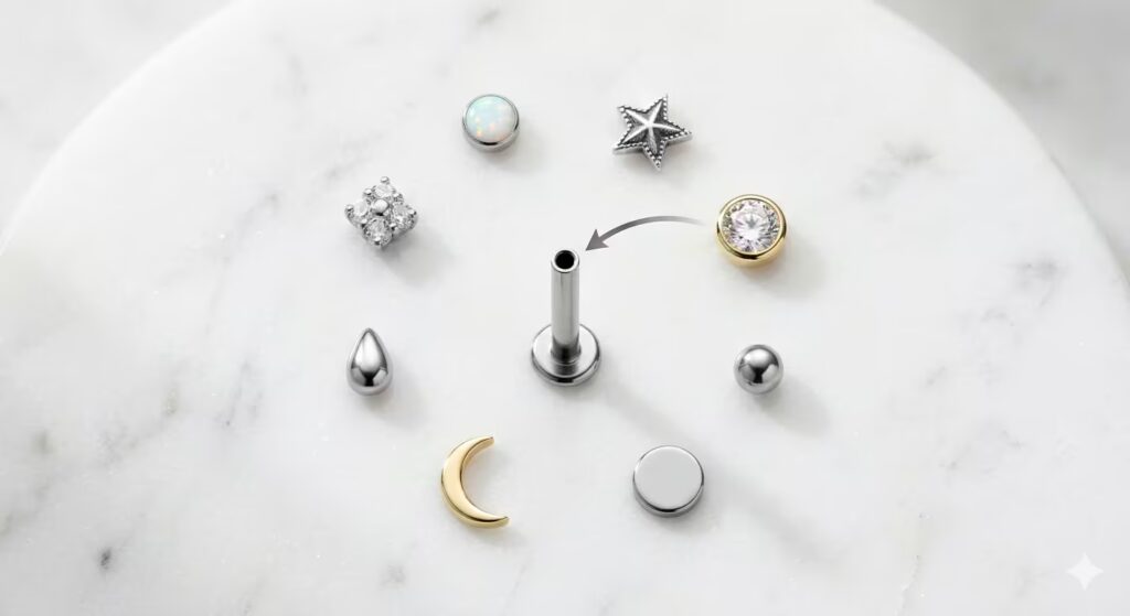 A clean educational product flat-lay on white marble demonstrating the threadless push-pin system.