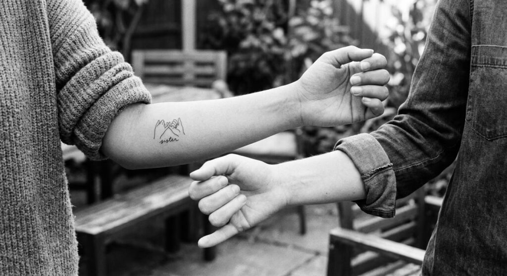 The Pinky Swear sister tattoo