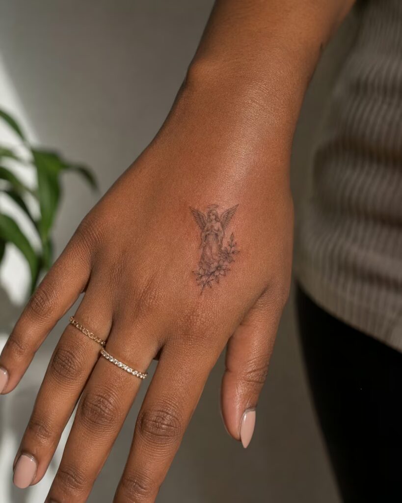 Angel of Devotion tattoo on hand