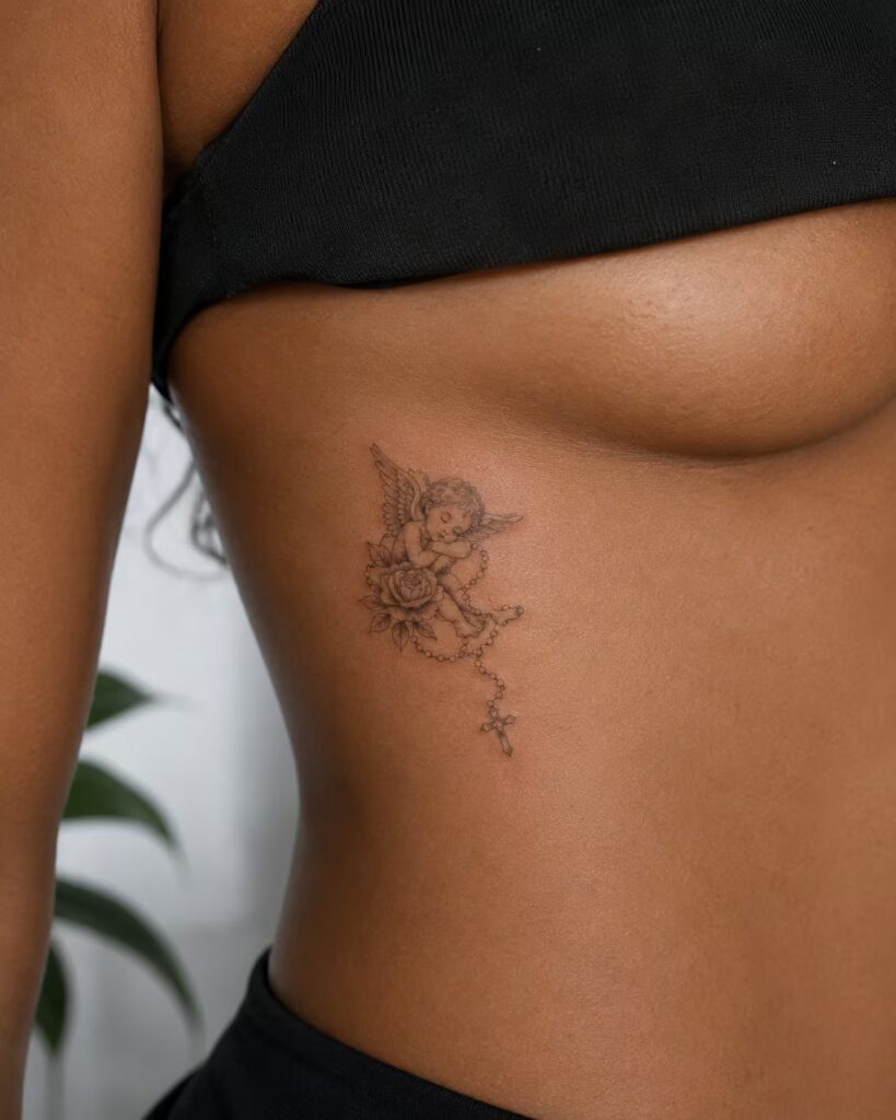 Cherub and Rosary angel tattoo on rib