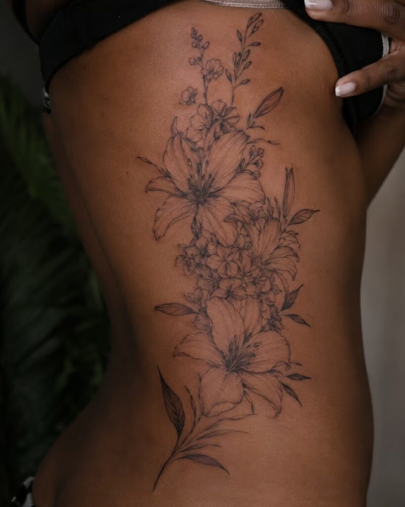 Lily and Wildflower Cascade Rib Flower Tattoo