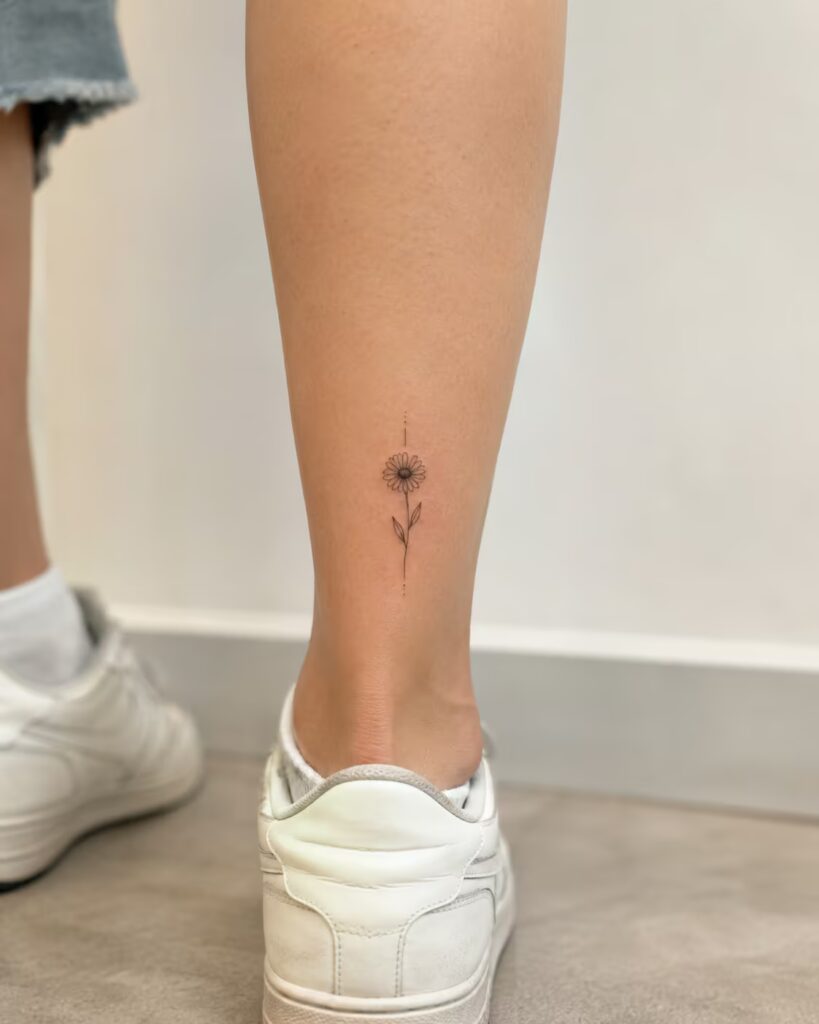 Single Stem Daisy Lower Leg Tattoo